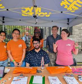Luke tabling at the Deaf Asian Street Festival with five other NYC Votes staff