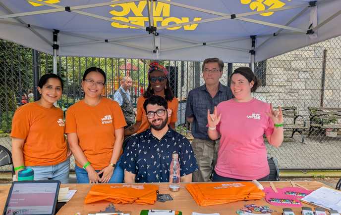 Luke tabling at the Deaf Asian Street Festival with five other NYC Votes staff
