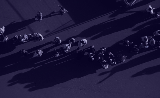  People Lined Up outside of poling booth with purple overlay